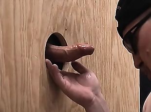 The warehouse has a gloryhole and it's where you'll always find this guy sucking cock